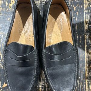 Tod’s Black Leather Penny Loafers